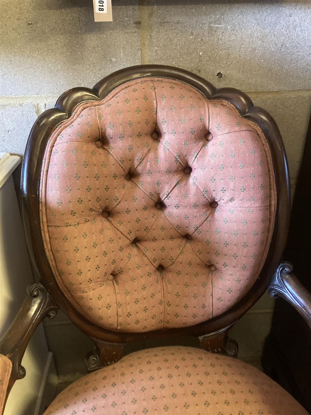 A Victorian mahogany framed buttoned back open armchair, width 66cm, depth 76cm, height 107cm